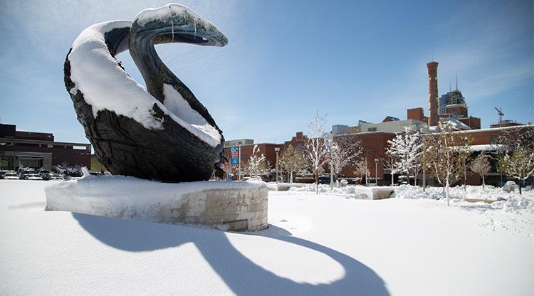 One World One Water sculpture on a snowy day on Auraria Campus.