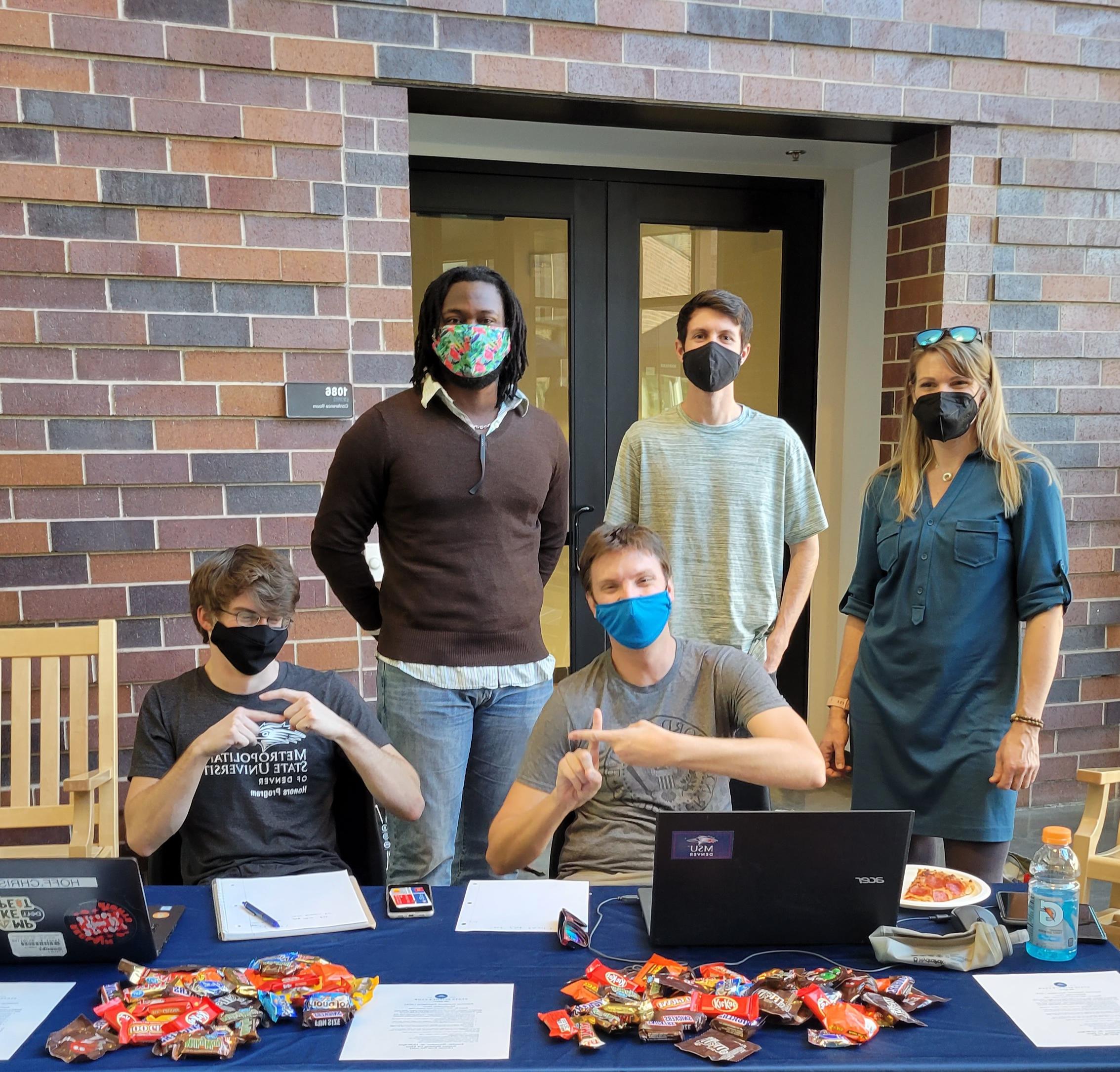 Students at a registration table on campus