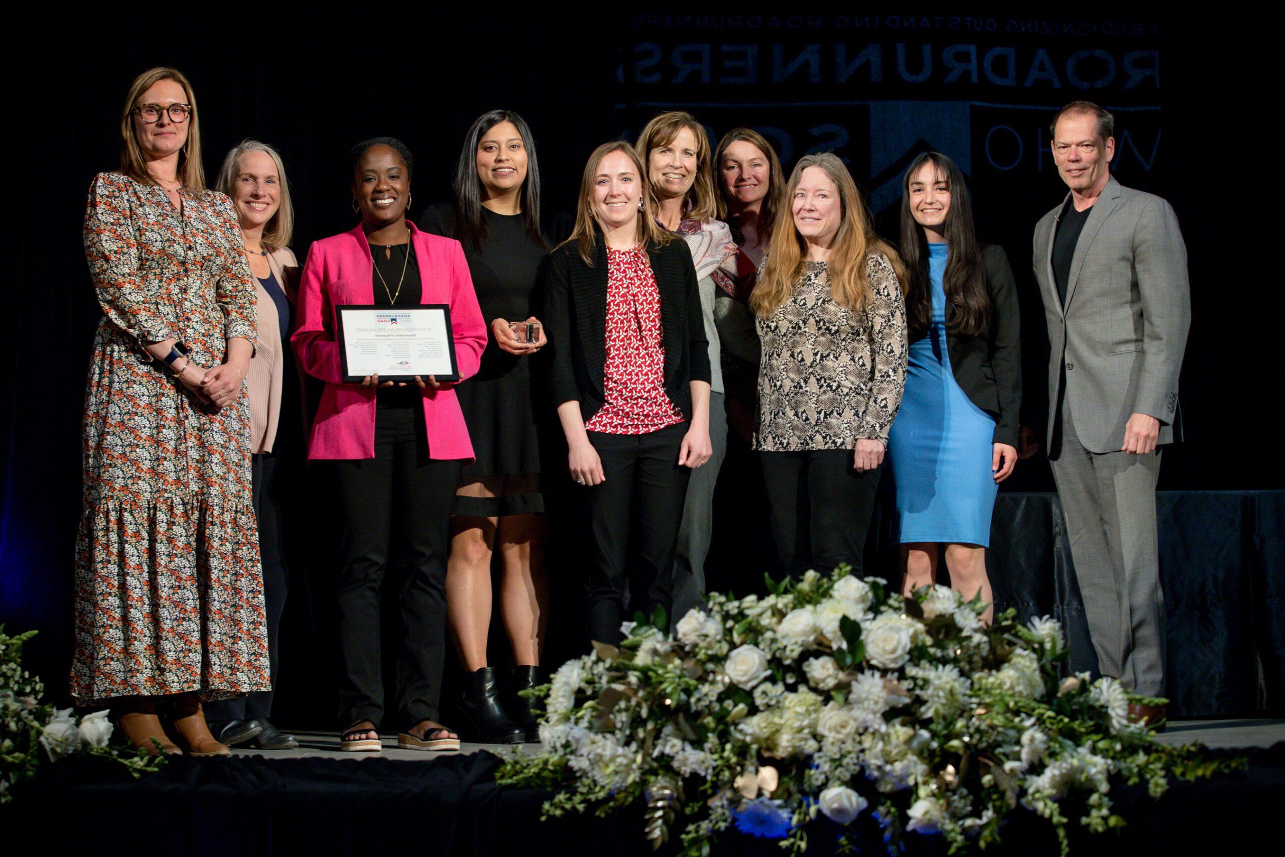A photo of award recipients at the annual Roadrunners who soar event in the spring of 2023 in the tivoli.